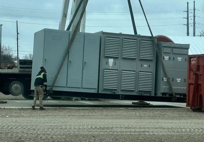 Crane setting a large diesel generator set in place — Frederick, MD