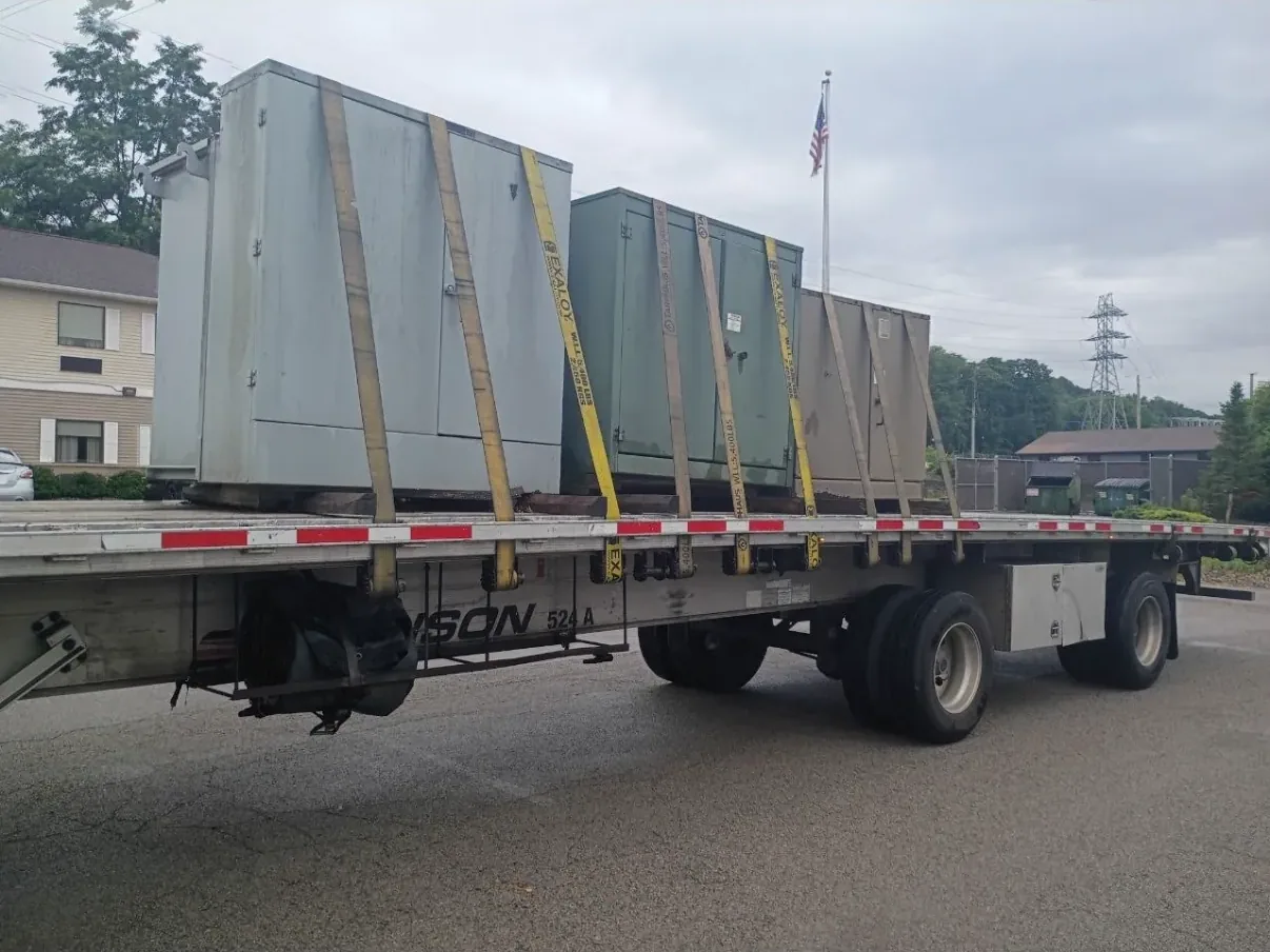 Wrapped and braced switchgear sections on a flatbed — Springfield, MA