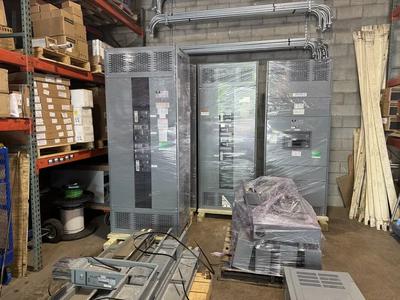Panelboard and crated electrical parts in a warehouse — Scranton, PA