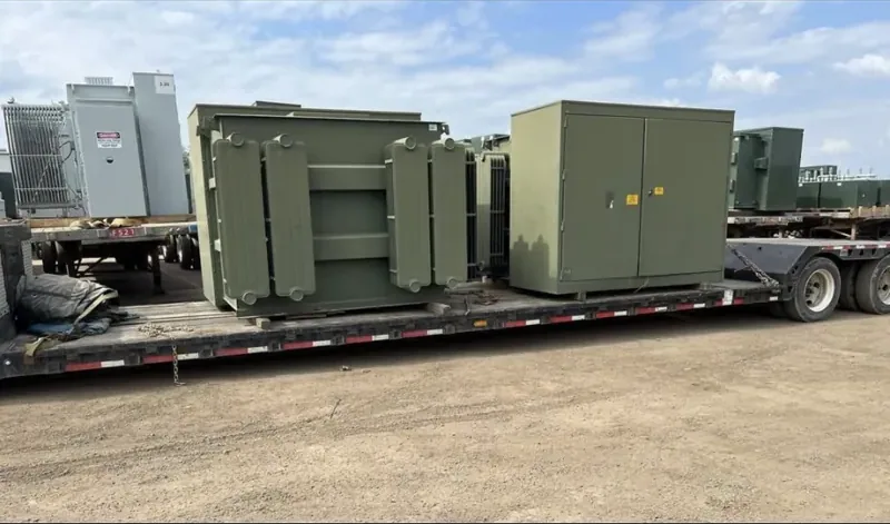 Transformers and enclosures strapped to a flatbed trailer — Baltimore, MD