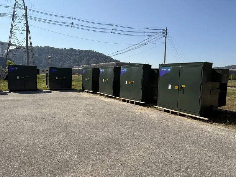 Line of pad-mount transformers under high-voltage transmission lines — Frederick, MD