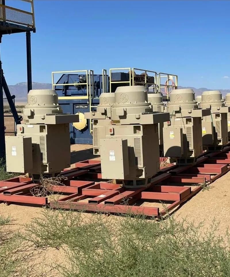 Row of distribution transformers on steel racks in a yard — Baltimore, MD
